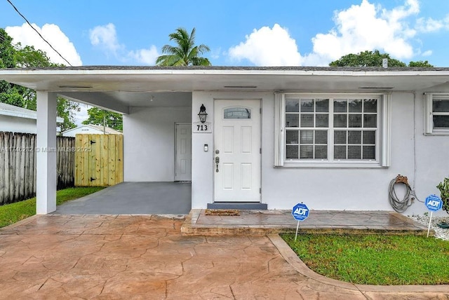 713 SW 6th Ave, Hallandale Beach, FL 33009 - property entrance with a carport
