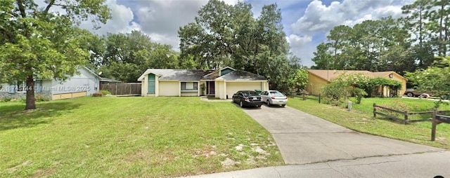 ranch-style home with an attached garage, driveway, a front yard, and fence