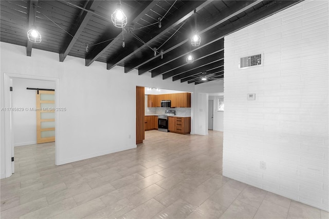 unfurnished room with beam ceiling, wooden ceiling, and a barn door