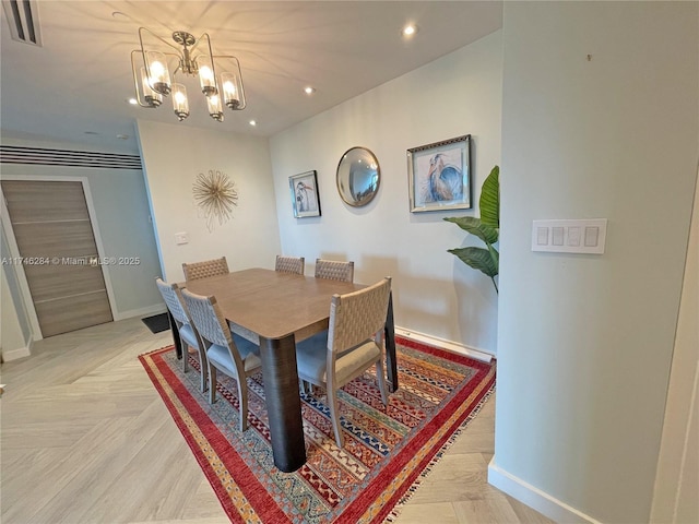 dining space with a chandelier and light parquet floors