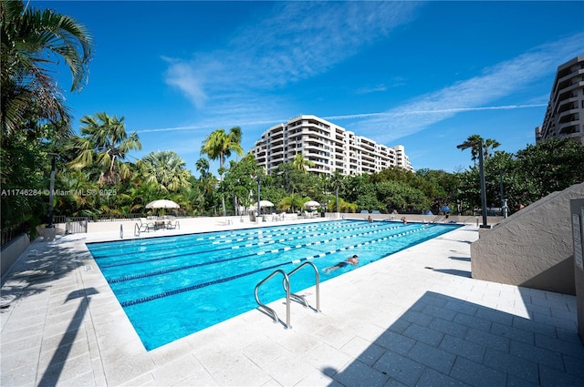 view of swimming pool with a patio