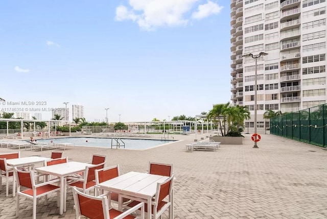 view of swimming pool featuring a patio area