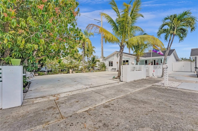 881 SW 137th Ct, Miami, FL 33184 - view of side of home with a fenced front yard and a gate