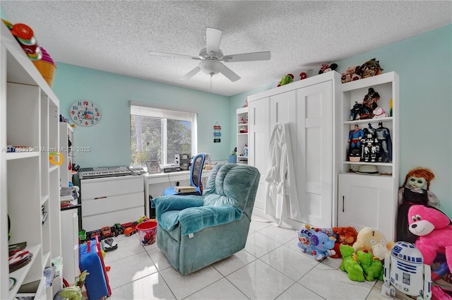 881 SW 137th Ct, Miami, FL 33184 - recreation room featuring light tile patterned floors, ceiling fan, and a textured ceiling