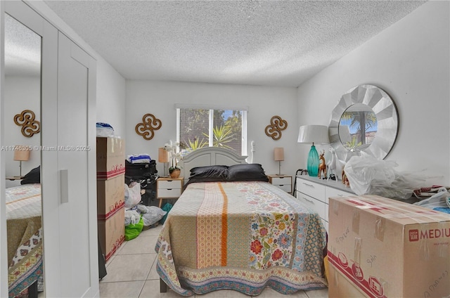 881 SW 137th Ct, Miami, FL 33184 - bedroom with a textured ceiling and light tile patterned floors