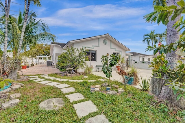 881 SW 137th Ct, Miami, FL 33184 - rear view of property featuring central air condition unit, a patio, fence, and stucco siding