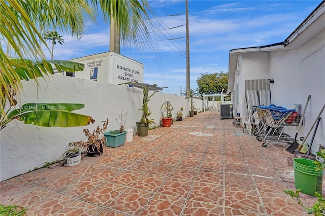 881 SW 137th Ct, Miami, FL 33184 - view of patio featuring a fenced backyard and central AC