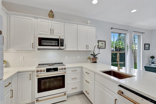 1826 Capeside Cir, Wellington, FL 33414 - kitchen with white appliances, a sink, white cabinets, ornamental molding, and light countertops
