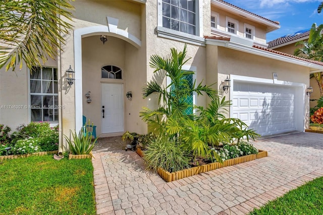 1826 Capeside Cir, Wellington, FL 33414 - view of exterior entry with stucco siding and driveway
