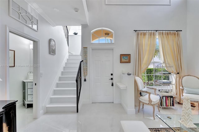 1826 Capeside Cir, Wellington, FL 33414 - entrance foyer with stairs, healthy amount of natural light, a towering ceiling, baseboards, and ornamental molding