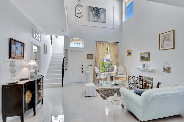 1826 Capeside Cir, Wellington, FL 33414 - living room featuring stairs, a high ceiling, tile patterned flooring, and crown molding