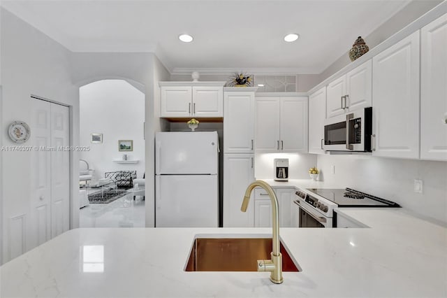1826 Capeside Cir, Wellington, FL 33414 - kitchen featuring white appliances, a sink, white cabinets, ornamental molding, and recessed lighting