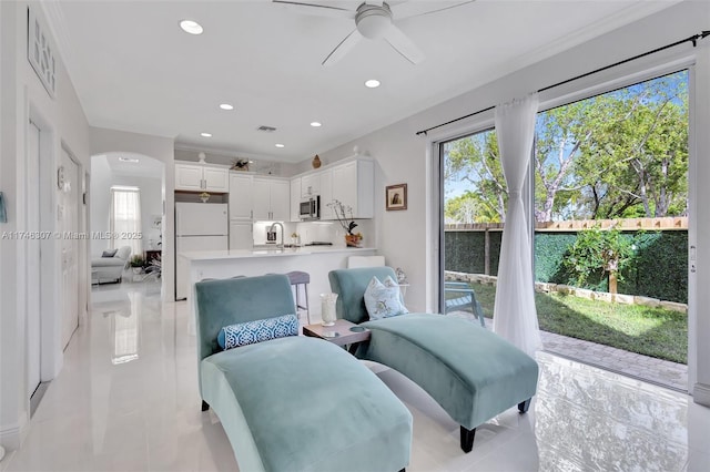 1826 Capeside Cir, Wellington, FL 33414 - living area with ceiling fan, light tile patterned floors, arched walkways, and recessed lighting