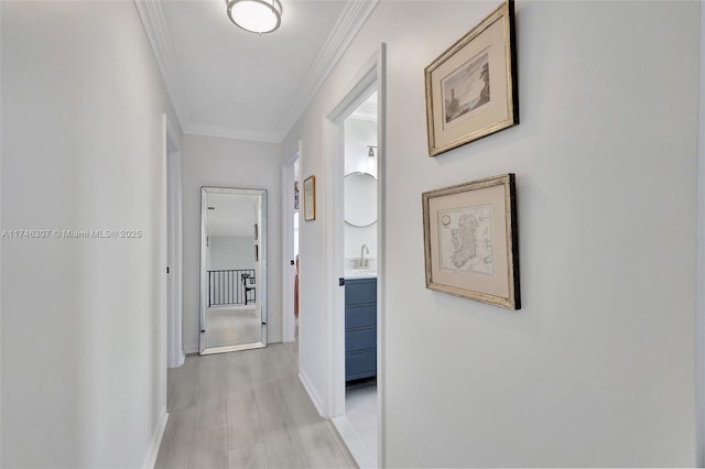 1826 Capeside Cir, Wellington, FL 33414 - hallway with baseboards, ornamental molding, and a sink