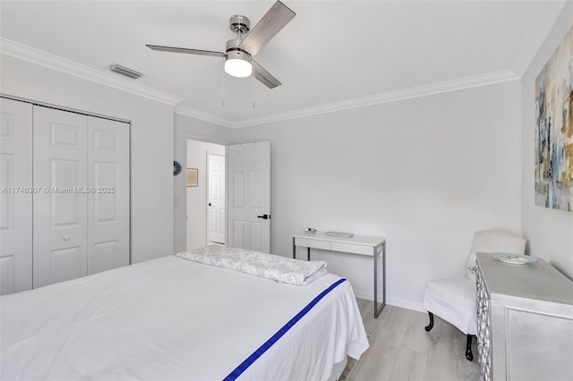 1826 Capeside Cir, Wellington, FL 33414 - bedroom with ornamental molding, light wood finished floors, baseboards, a ceiling fan, and a closet
