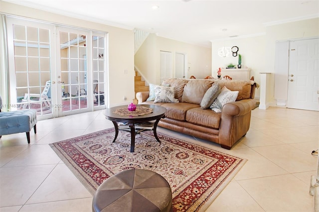 tiled living room with crown molding and french doors