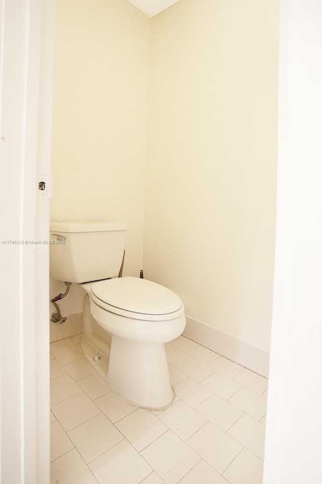 bathroom featuring tile patterned flooring and toilet