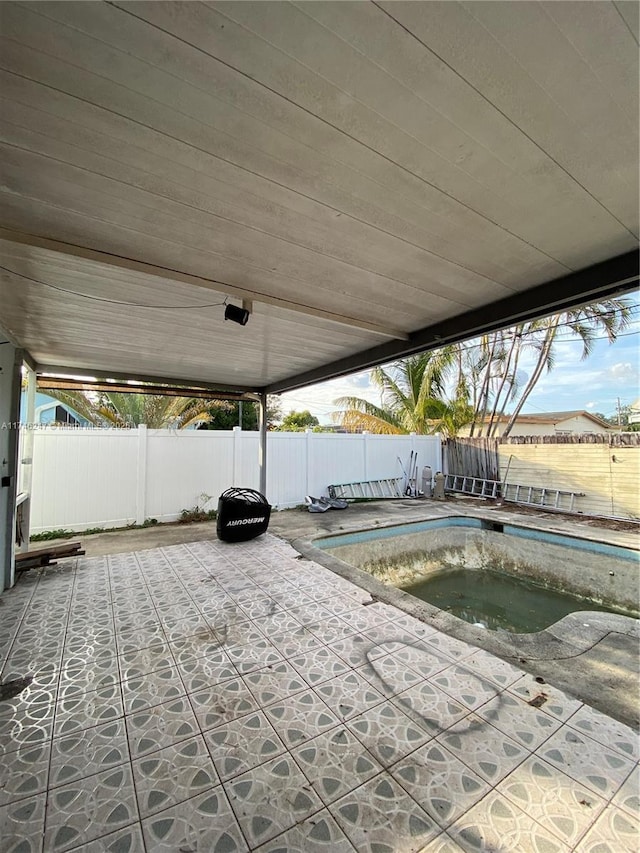 view of pool featuring a jacuzzi