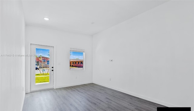 409 NW 4th Ave, Hallandale Beach, FL 33009 - empty room with hardwood / wood-style floors