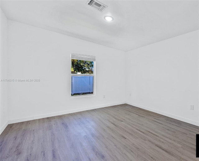409 NW 4th Ave, Hallandale Beach, FL 33009 - spare room with hardwood / wood-style floors