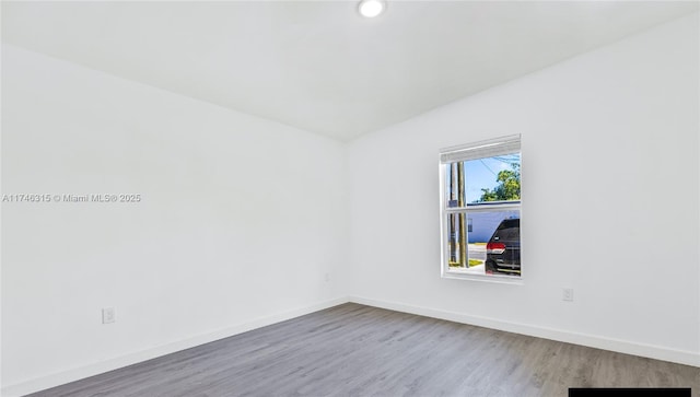 409 NW 4th Ave, Hallandale Beach, FL 33009 - spare room with wood-type flooring