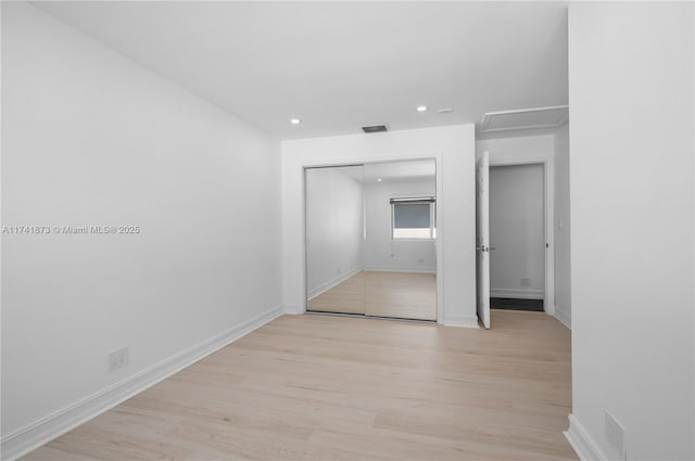 unfurnished room with light hardwood / wood-style flooring