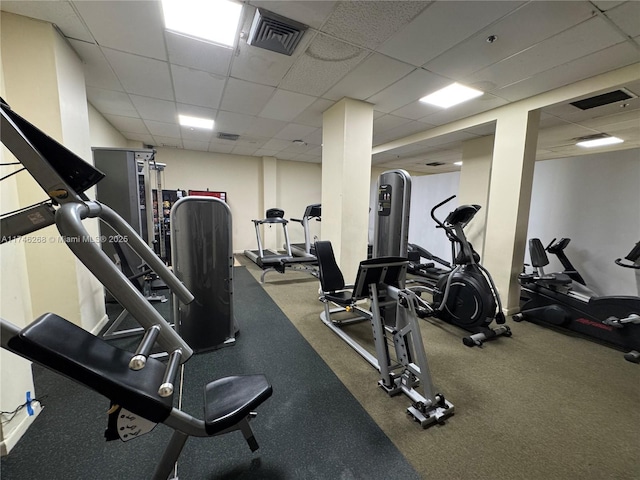 workout area featuring a drop ceiling