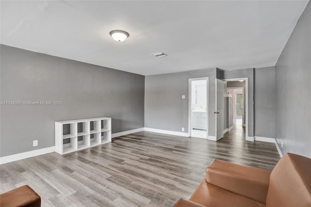 unfurnished living room with hardwood / wood-style floors