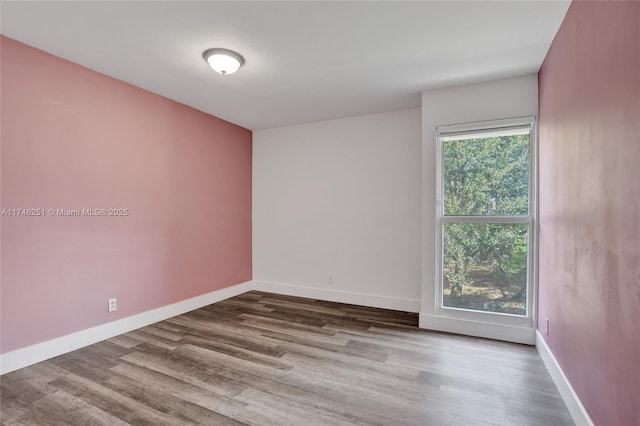 unfurnished room featuring hardwood / wood-style floors