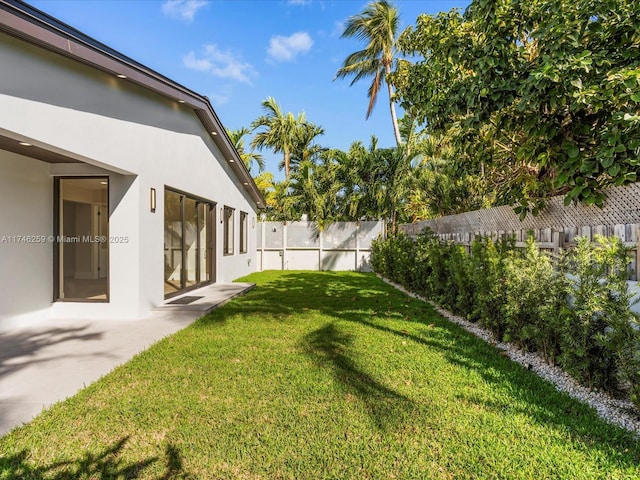 view of yard with a fenced backyard