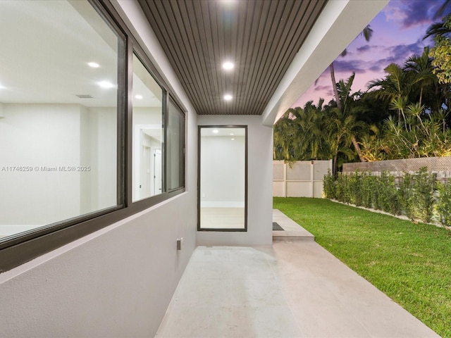 view of patio featuring fence