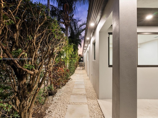 view of side of property featuring stucco siding