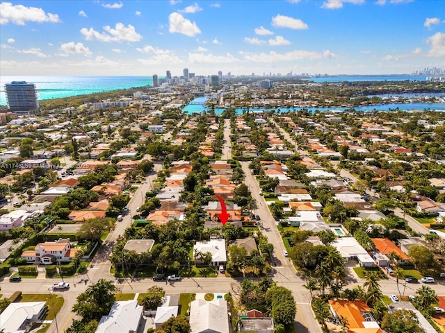 bird's eye view featuring a water view and a city view