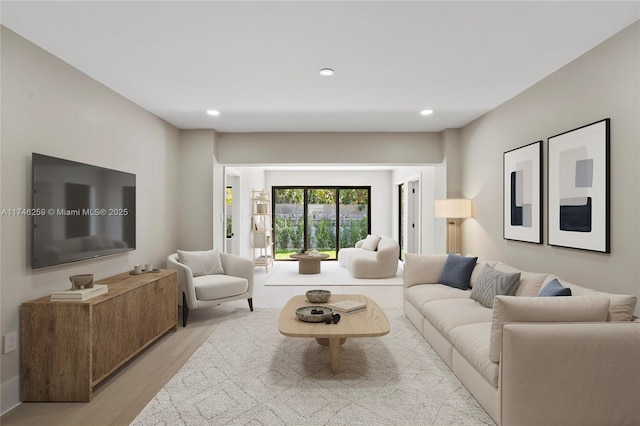 living area with light wood-type flooring and recessed lighting