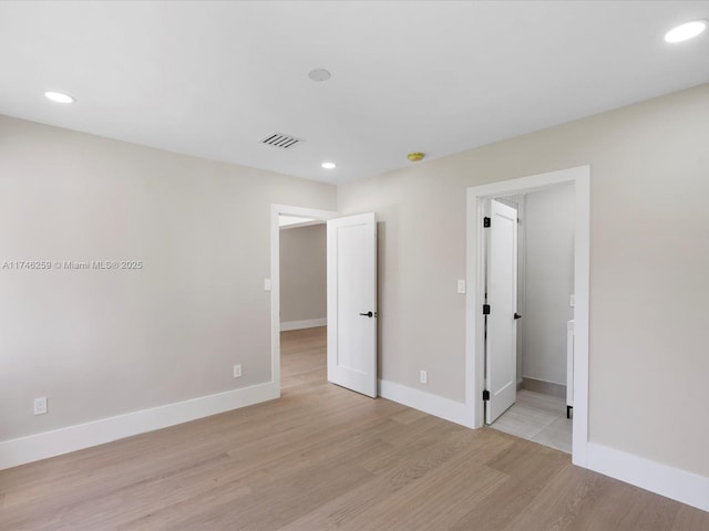 interior space with light wood-type flooring and baseboards