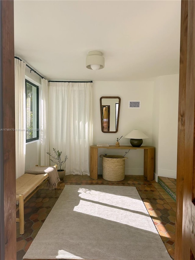 interior space featuring dark tile patterned flooring