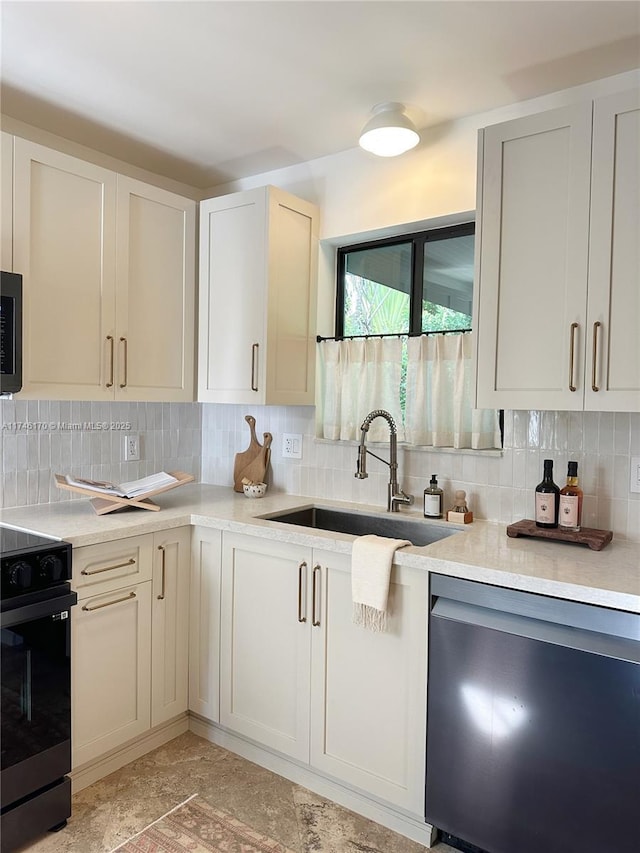 kitchen featuring stainless steel dishwasher, range, sink, and backsplash