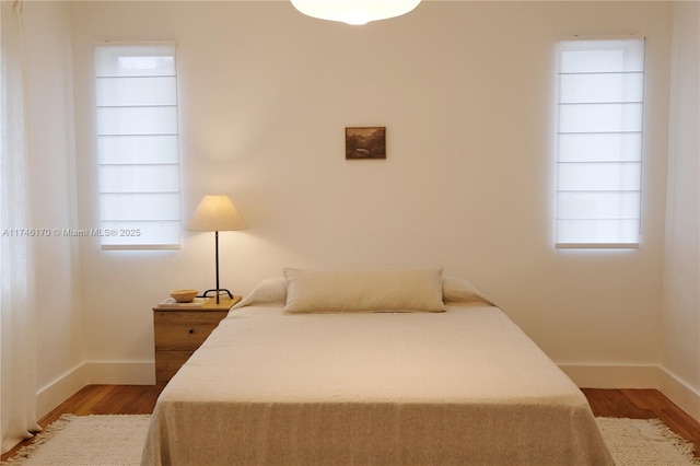 bedroom with light wood-type flooring