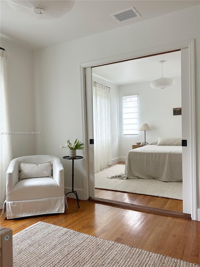 bedroom featuring hardwood / wood-style flooring and a closet