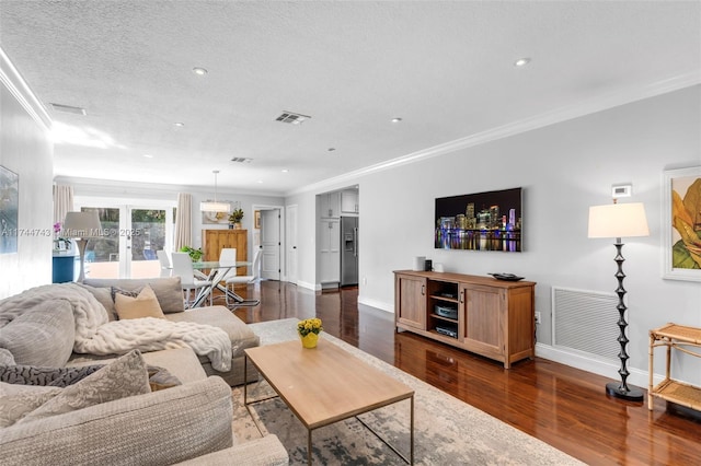 living room featuring ornamental molding, french doors, dark wood-style floors, and visible vents