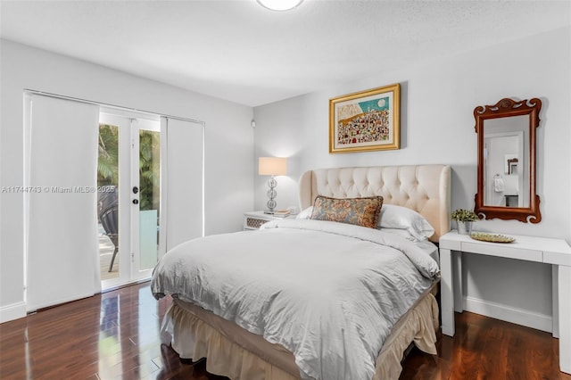 bedroom with baseboards, french doors, dark wood-style flooring, and access to exterior