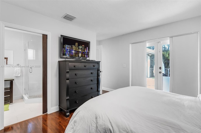 bedroom with baseboards, visible vents, wood finished floors, access to outside, and french doors