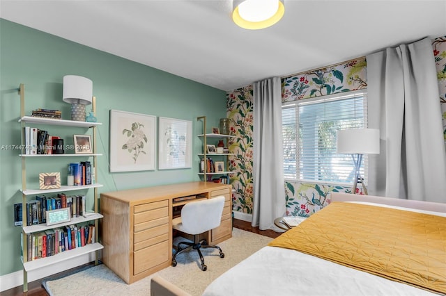 bedroom with light wood-style floors and baseboards