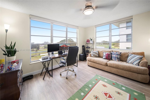 office space featuring wood finished floors and baseboards