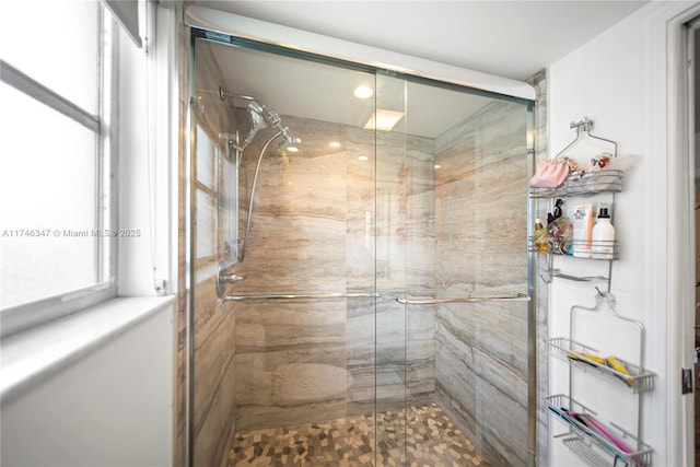 bathroom with a shower stall