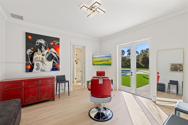 interior space with crown molding, light hardwood / wood-style flooring, and french doors