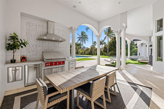 view of patio featuring a grill, outdoor lounge area, and exterior kitchen