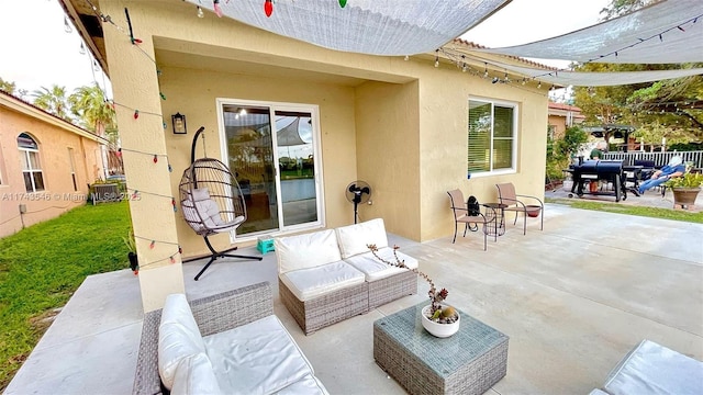 view of patio / terrace with an outdoor living space, fence, and a grill