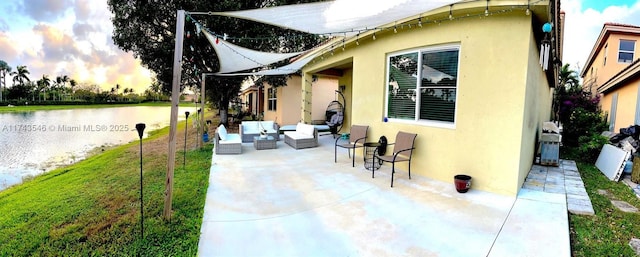 3772 NE 9th Ct, Homestead, FL 33033 - view of patio / terrace with outdoor lounge area and a water view