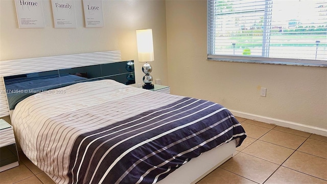 tiled bedroom with baseboards